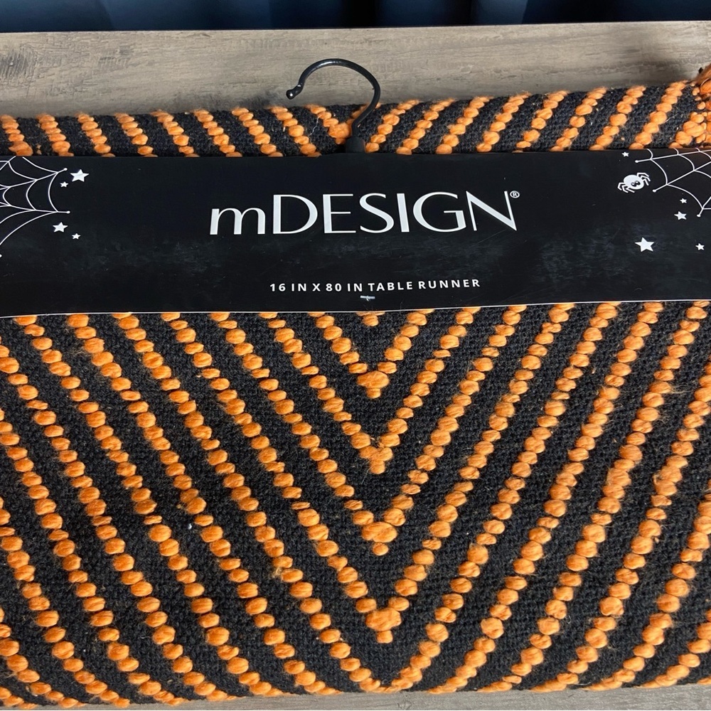 mDESIGN 16 x 80” table runner with an arbor stitch woven pattern, Orange & Black